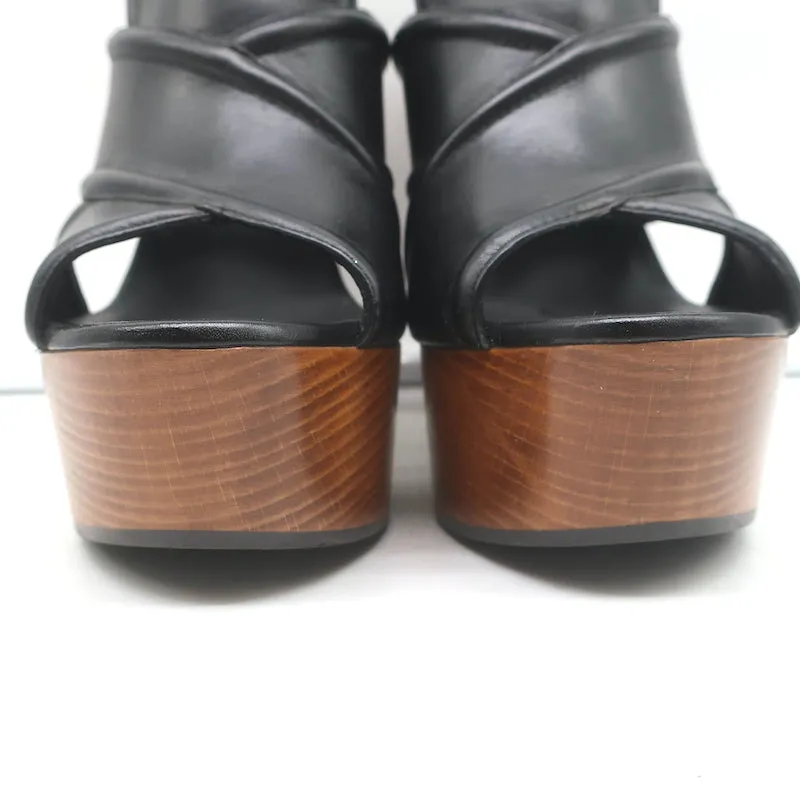 Saint Laurent Sandalen mit Kreuzriemen und Plateauabsatz aus schwarzem Leder Größe 37
